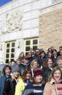students and faculty in front of the education building